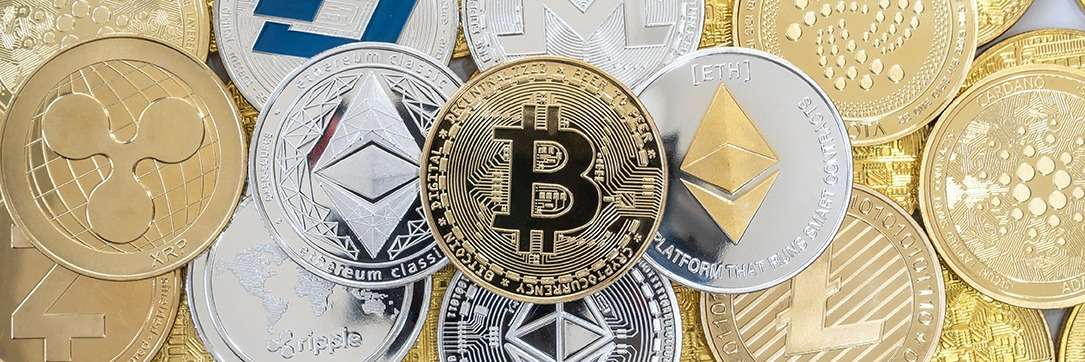 A group of btc coins, showcasing the wonders of blockchain technology, are elegantly arranged on a pristine white background.