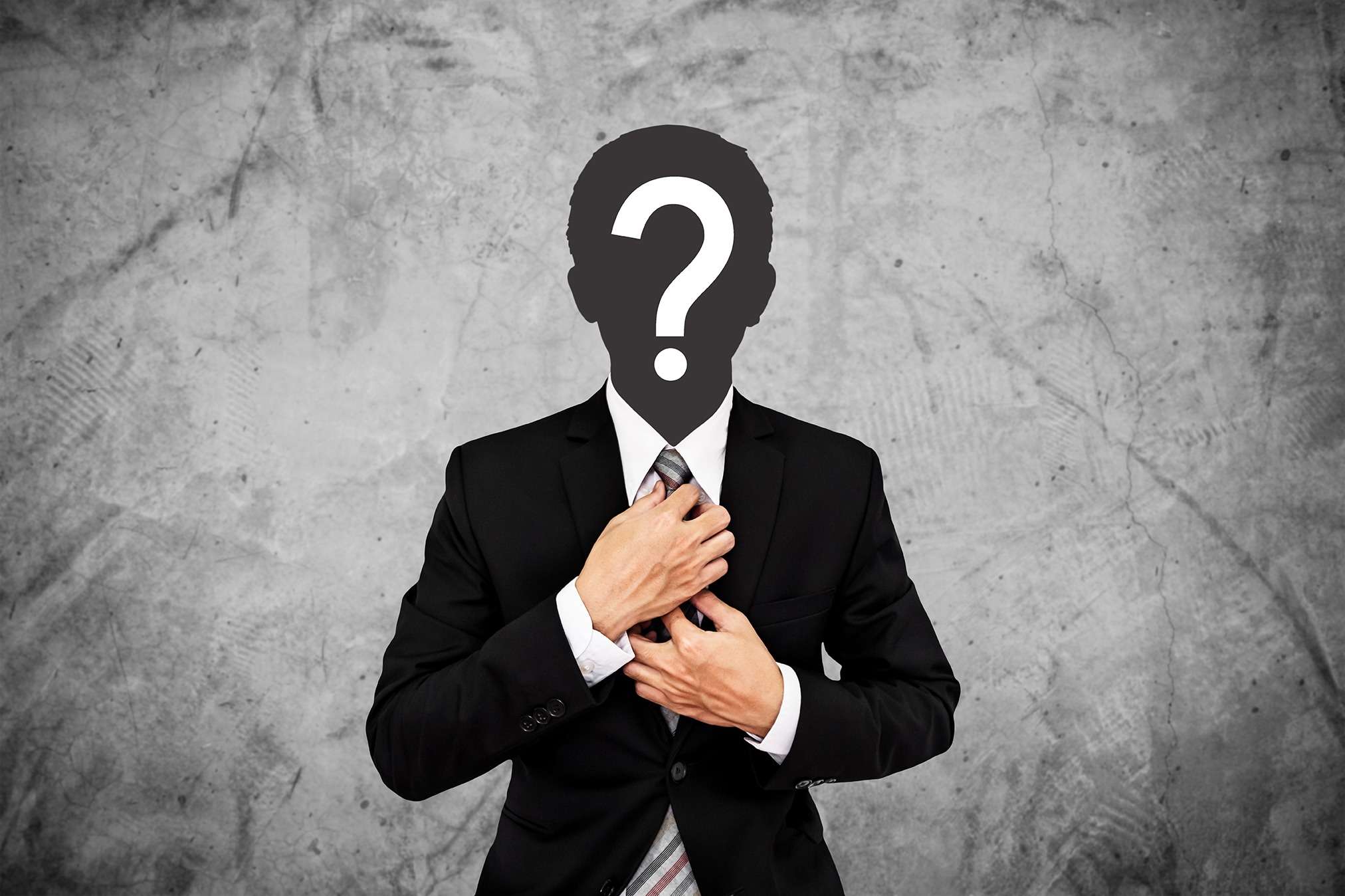 A businessman with a question mark on his chest, pondering the potential of blockchain.