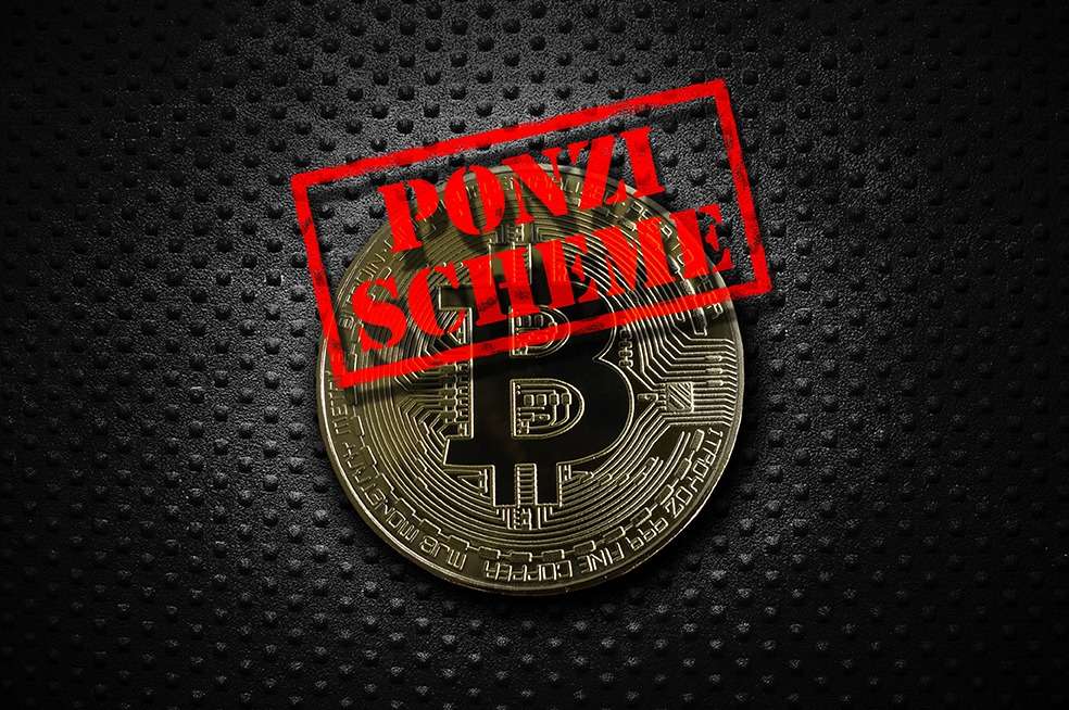 An image of a bitcoin with the words "ponzi scheme" on it, highlighting the potential risks within the world of cryptocurrency.