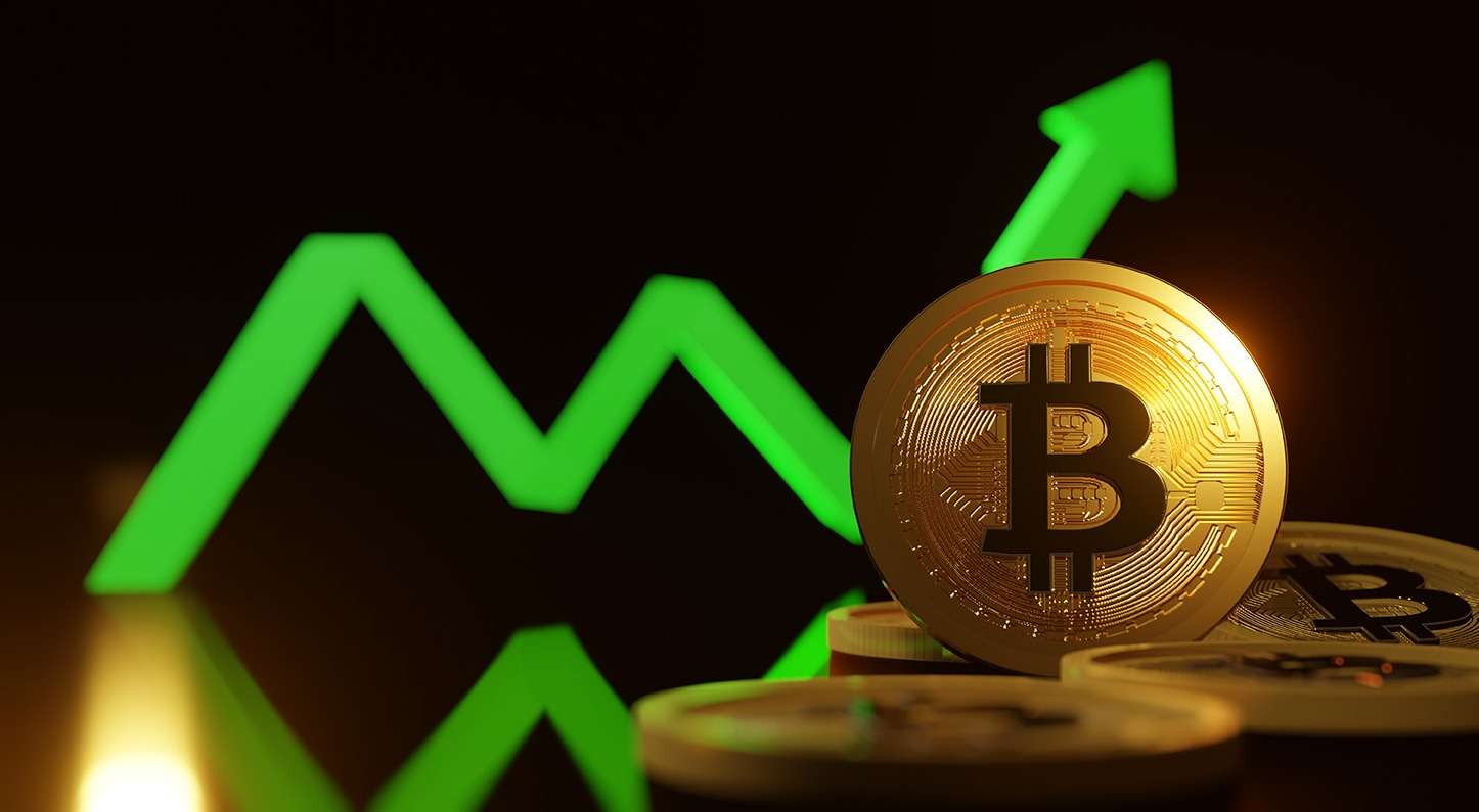 Bitcoin coins on a dark background.