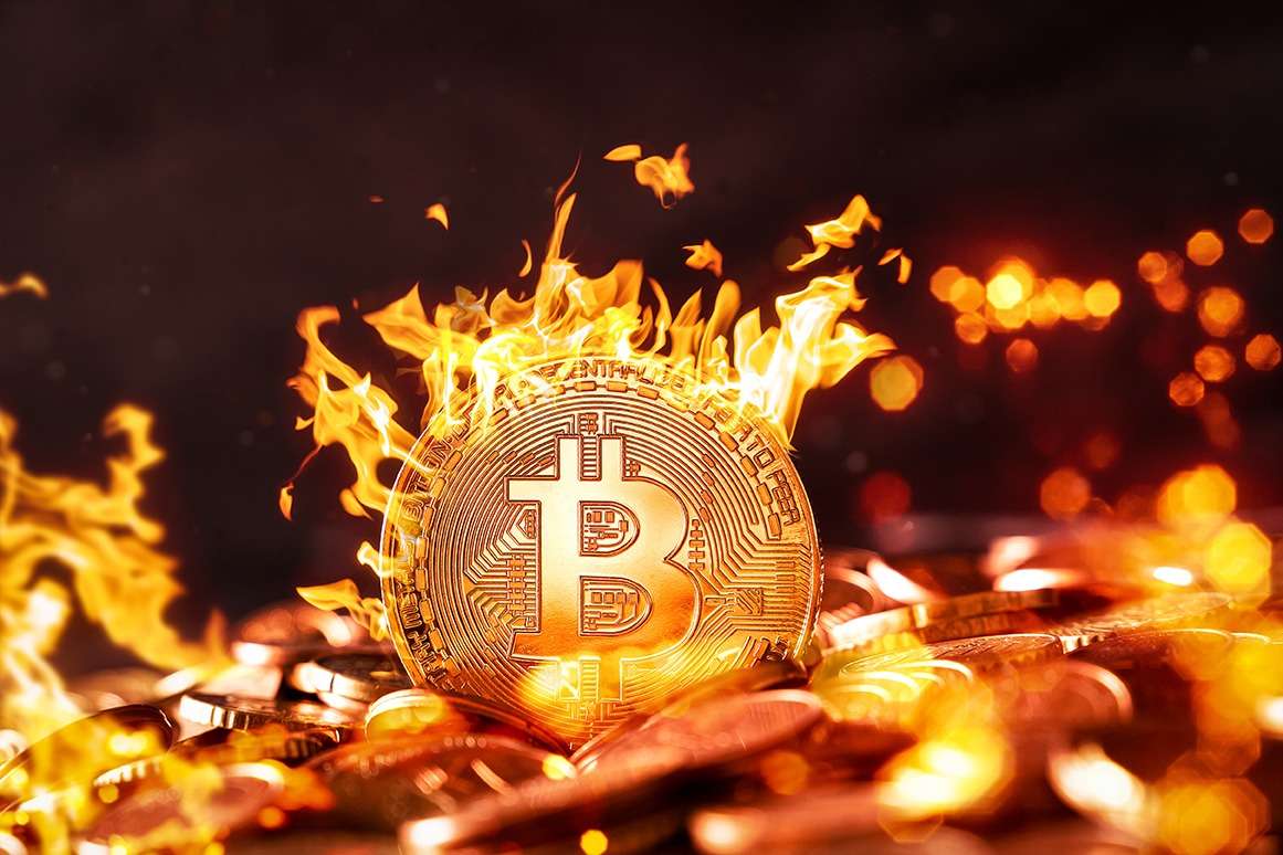 Bitcoin, the revolutionary cryptocurrency, blazes with unprecedented intensity amidst a treasure trove of coins, showcasing its prowess in the realms of NFTs and blockchain technology.