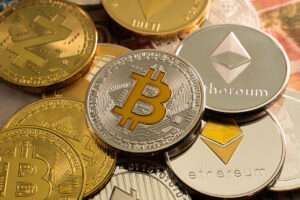A pile of crypto coins, altcoins and bitcoin on top of a pile of money in the world of DeFi and ukcrypto.