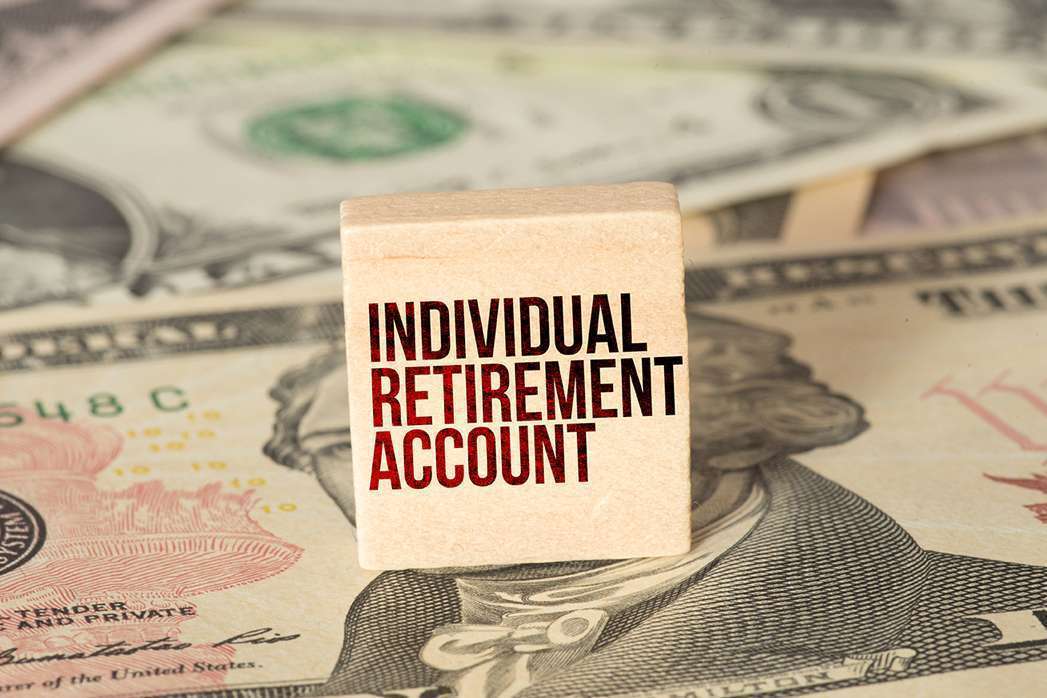 Dollar banknotes and IRA Individual Retirement Account