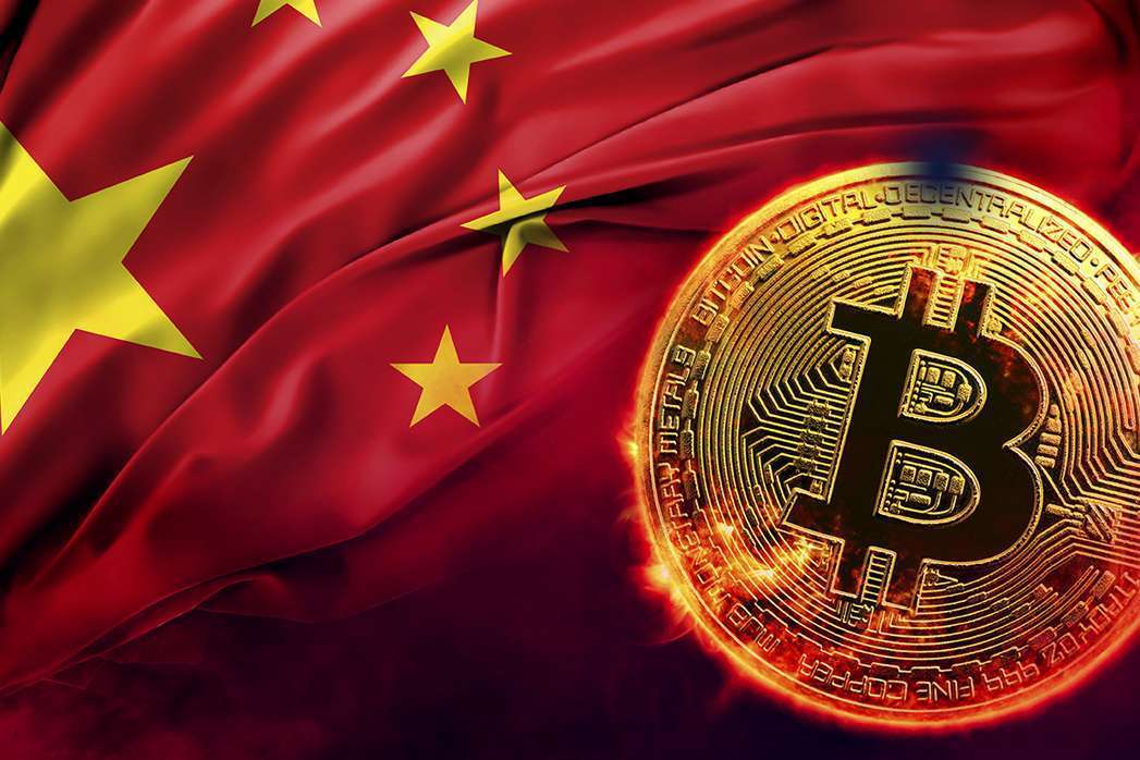 burning golden bitcoin coin on the Chinese flag background