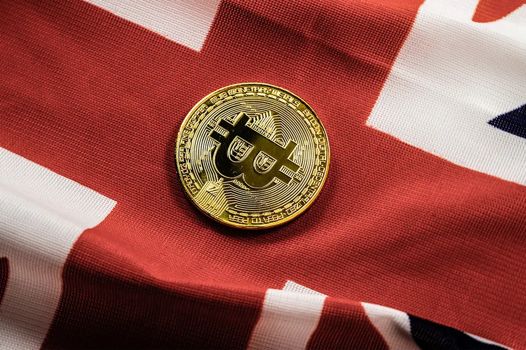Bitcoin against British UK flag