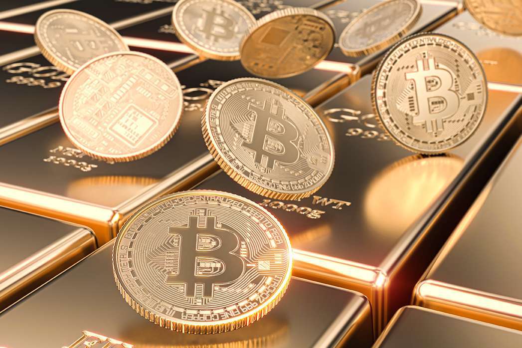 gold bitcoin coins laid on ingots. concept of cryptocurrency and money.