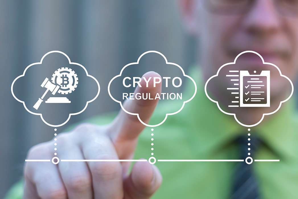Trader using virtual touch screen presses inscription: CRYPTO REGULATION. Concept of Bitcoin Crypto Regulation and Law. Cryptocurrency Regulation Laws.