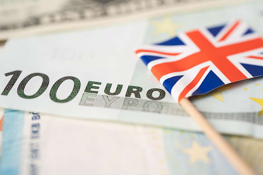 United Kingdom flag on Euro banknotes, finance and accounting, banking concept.