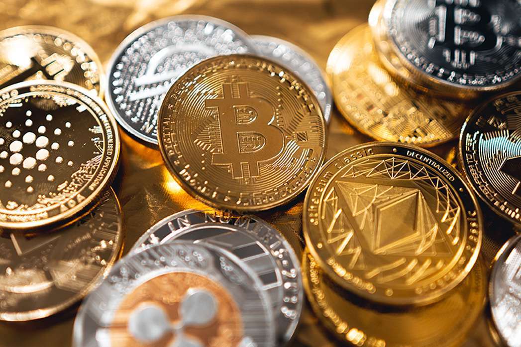 Crypto coins on gold background.
