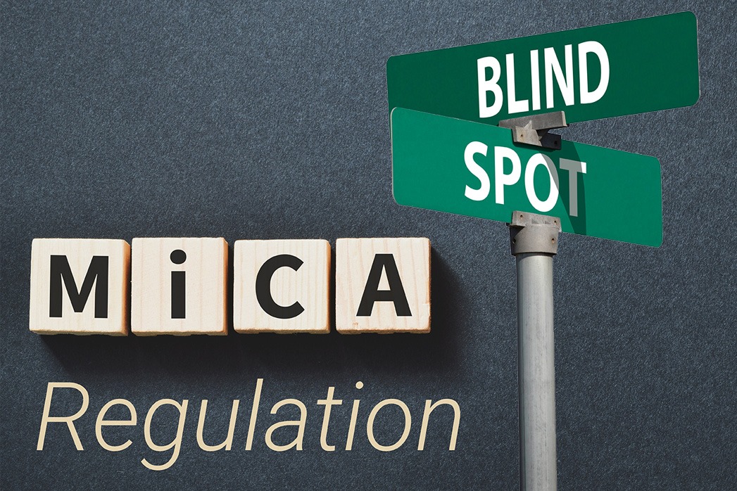 Markets in Crypto-Assets (MiCA) Regulation inscription on wooden blocks on dark background.