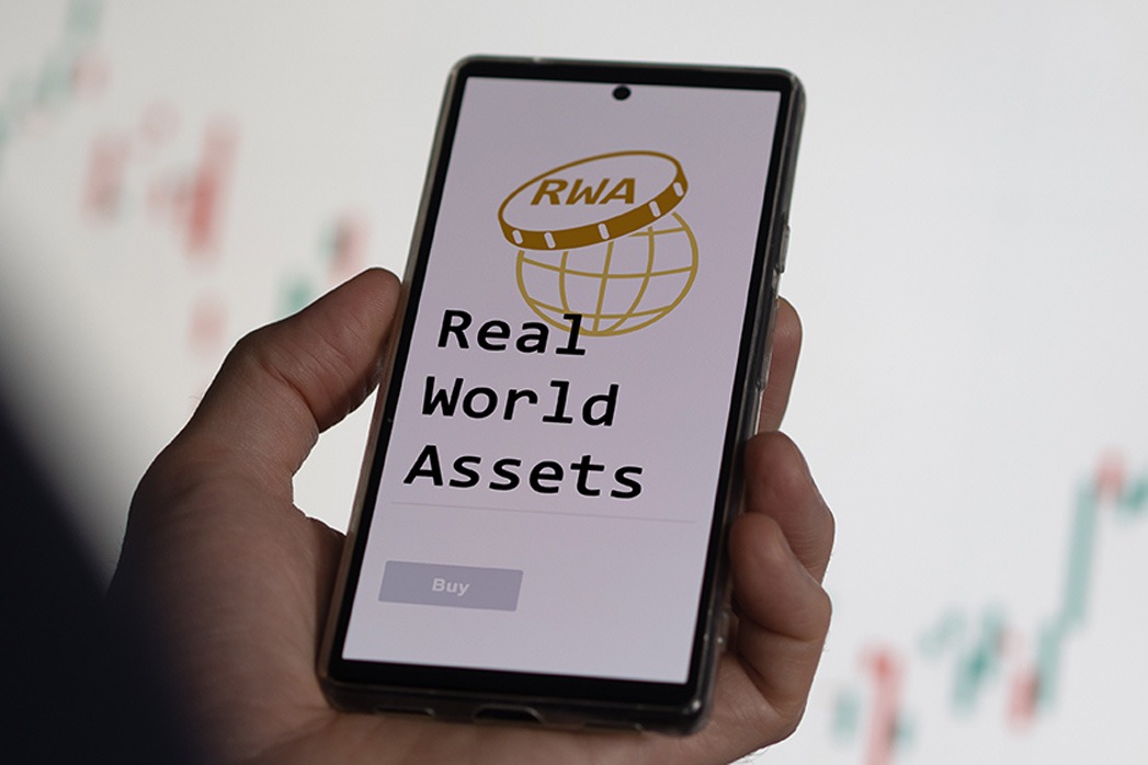 RWA ETF on a screen, investing in real world assets, R.W.A. application, an investor analyzing crypto Real World Assets.