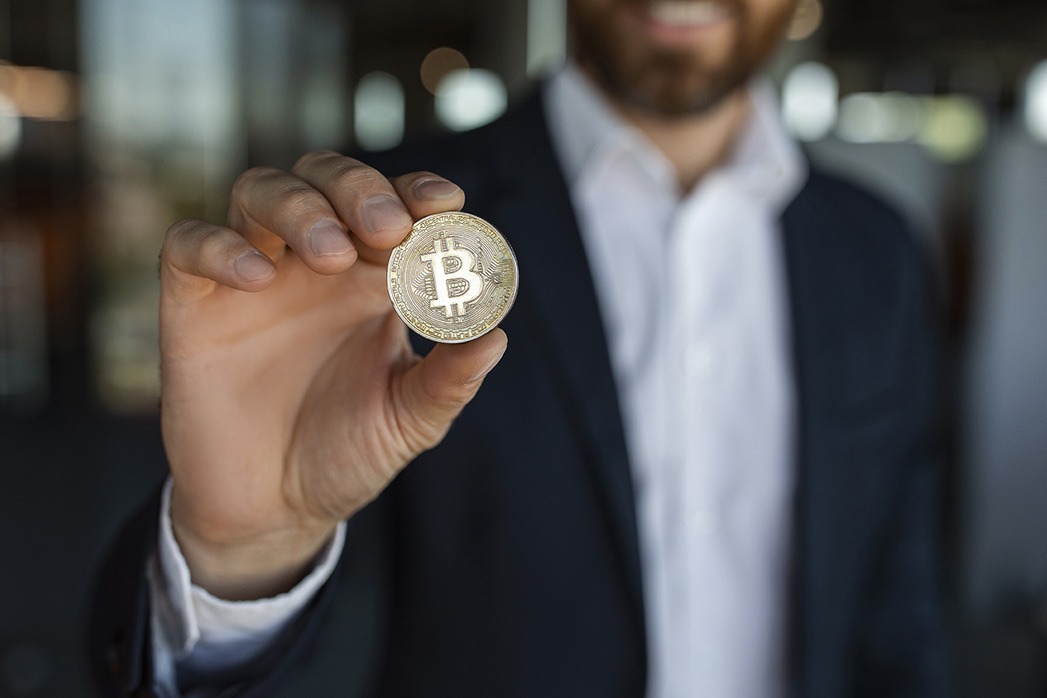 Digital cryptocurrency, trading on stocks and markets. Unrecognisable middle-aged businessman.