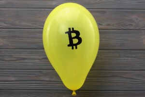 Yellow balloon with a Bitcoin sign.