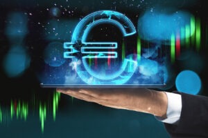 Close Up Of Hand Holding Tablet Computer With Creative Glowing Polygonal Euro City Hologram On.