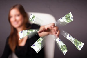 Pretty Young Woman Sitting And Throwing Money.