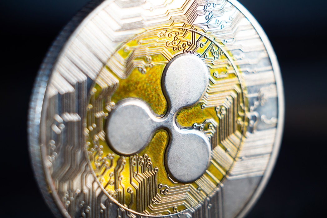 Ripple coin on a blurred background.