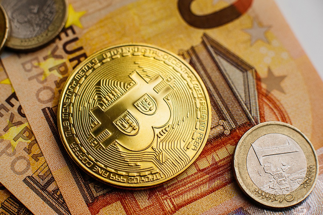 Bitcoin, Currency, digital, finance, economy. Golden Bitcoin coin on us dollars close up.