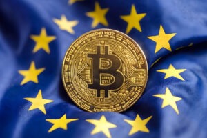 European union flag and Bitcoin. Europe cryptocurrency, digital gold finance investment regulation.