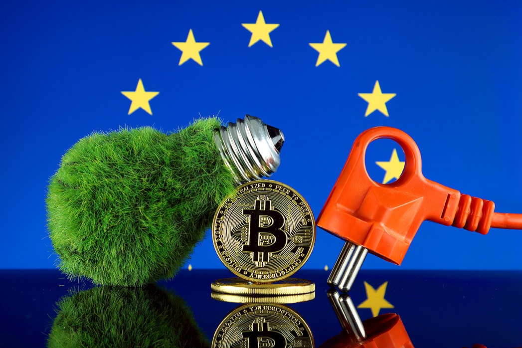 Bitcoin (BTC), green renewable energy concept, and European Union Flag. Electricity prices, energy saving in the cryptocurrency mining business.