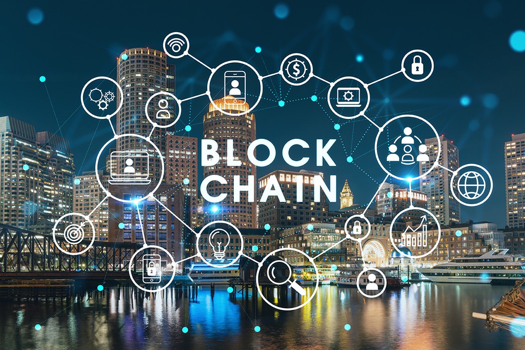 City view panorama of Boston Harbour and Seaport Blvd at night time, Massachusetts. Decentralized economy. Building exteriors of financial downtown.