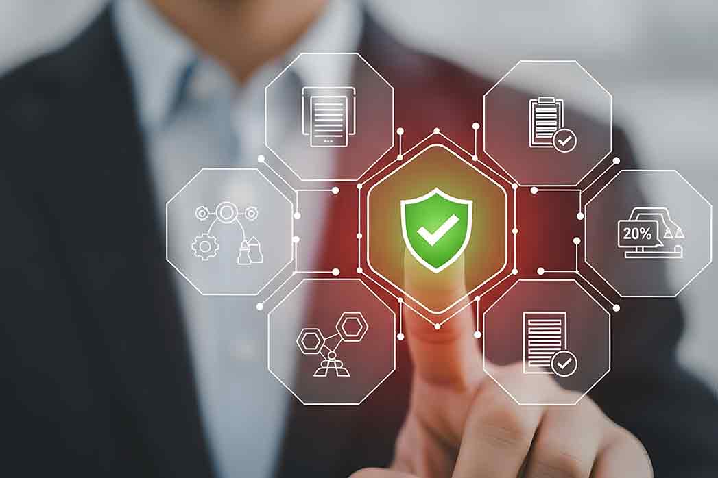 Businessman activating data protection shield with finger on digital interface.