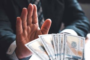 Businessmen refuse to accept bribes in signing contracts. The concept of anti-corruption.