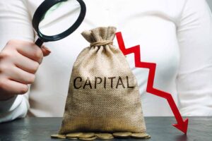 A woman analyses data on the cost of capital in the company.