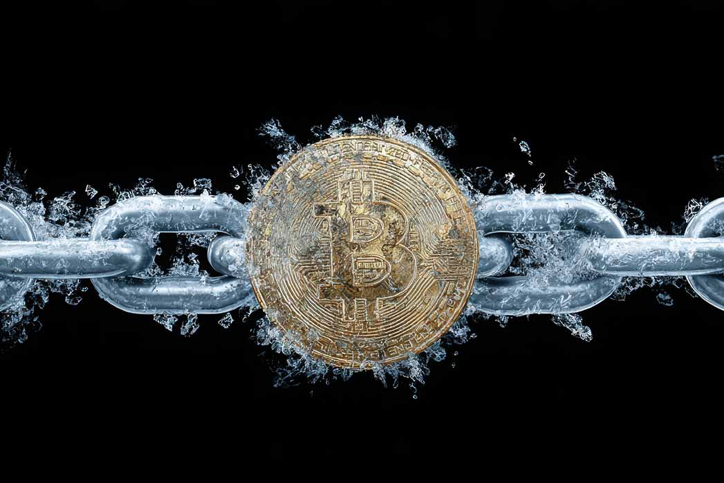 Bitcoin coin breaking out of icy chains, symbolising freedom from traditional banking and the rise of decentralised money.
