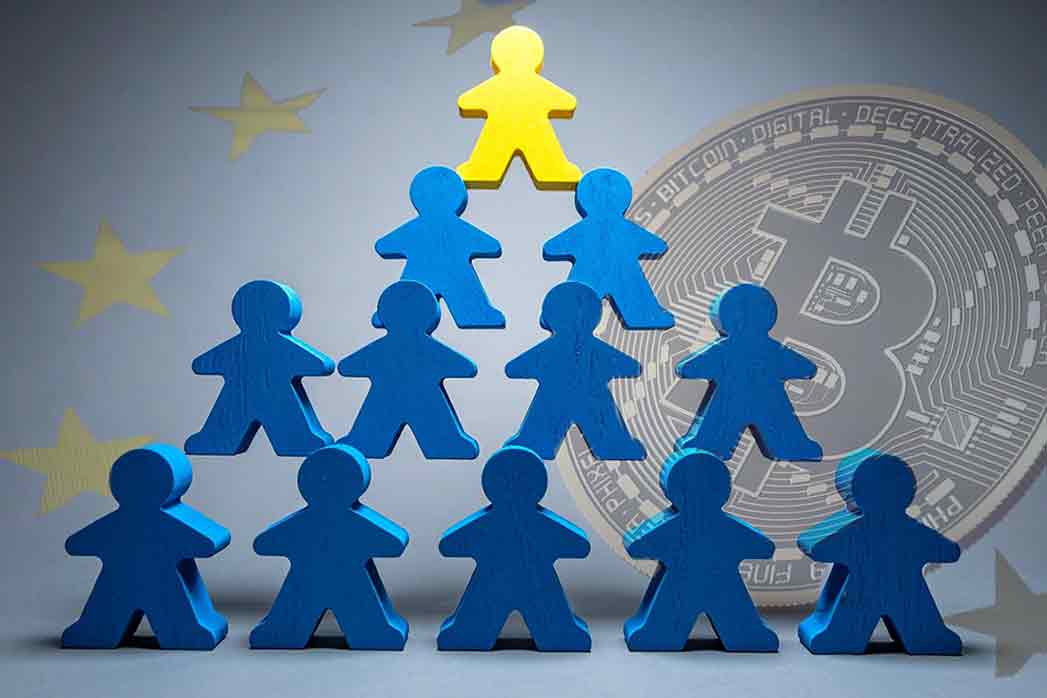 A glowing yellow wooden figure standing at the peak of a pyramid of blue figures on a grey background.