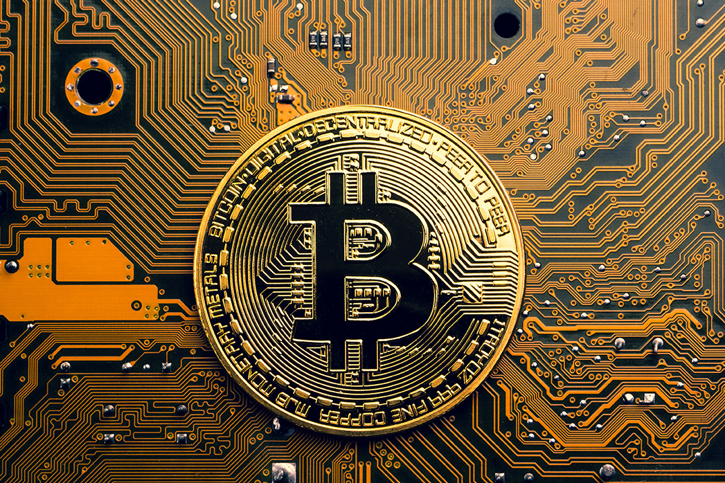 Bitcoin symbol on a mainboard.