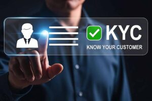 KYC Know Your Customer verification process with a person holding an ID card and a phone.