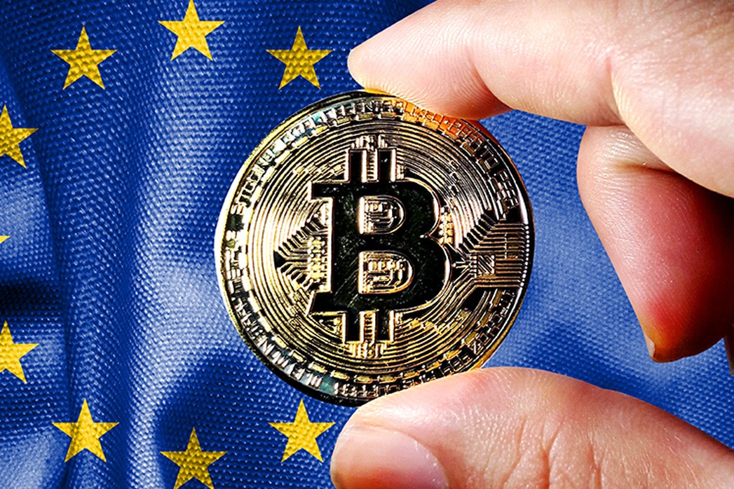 Hold the physical version of Bitcoin (the new virtual currency) and the European Union flag. EU cryptocurrency and blockchain technology investor concept map Downloaded File #: 470223820 Hold the physical version of Bitcoin (the new virtual currency) and the European Union flag.