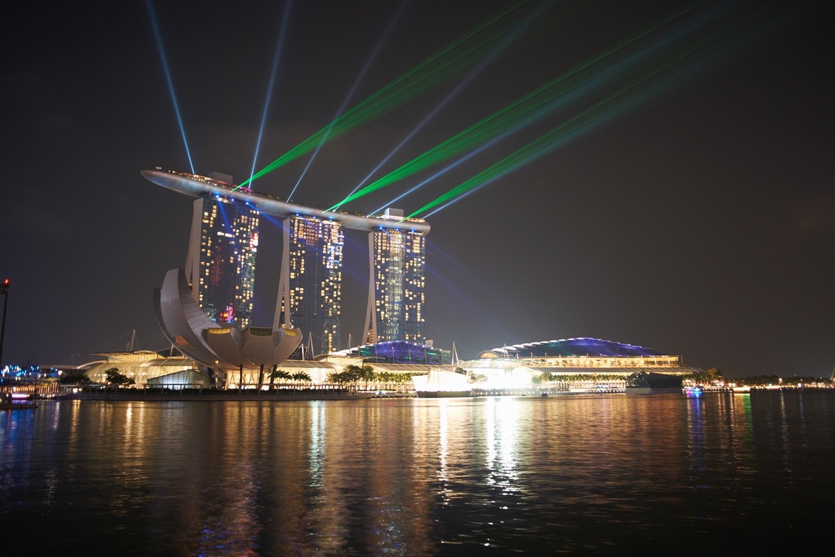 Night view of spotlights and marina sands bay hotel, Singapore.