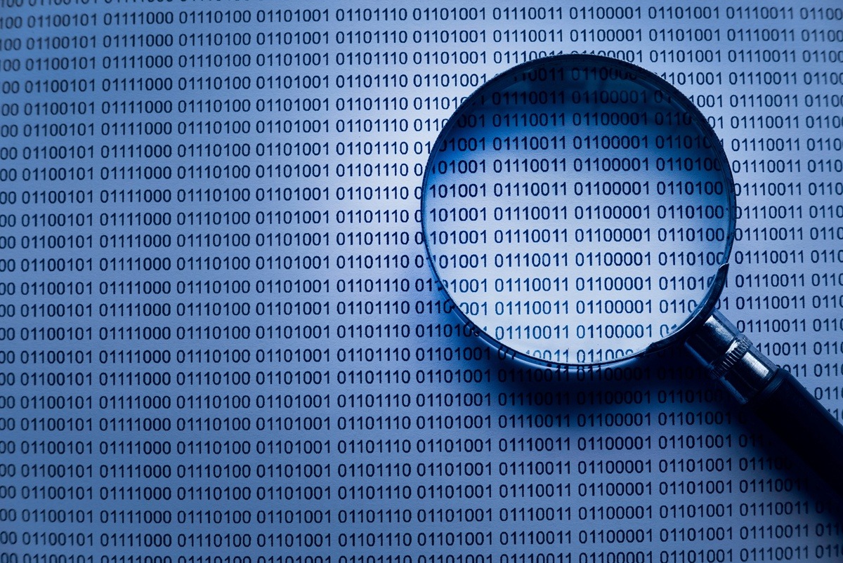 Magnifying Glass Inspecting Binary Code Information Background.